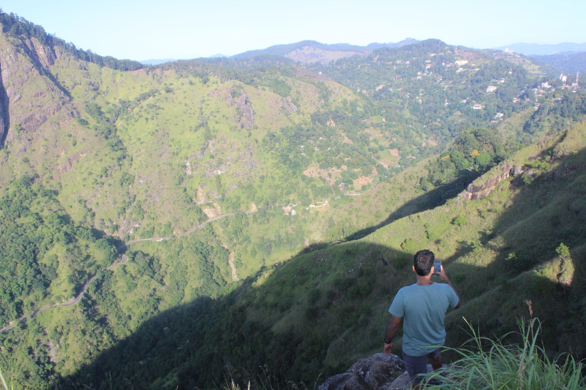 A man admires the view from Little Adam's Peak in Ella, Sri Lanka