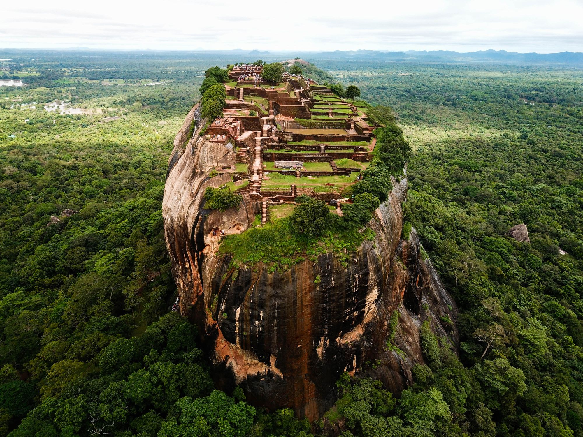 An aerial view of Sigiriya, the rock fortress in Sri Lanka, that shows the ruins of the ancient palace on top of the rock.