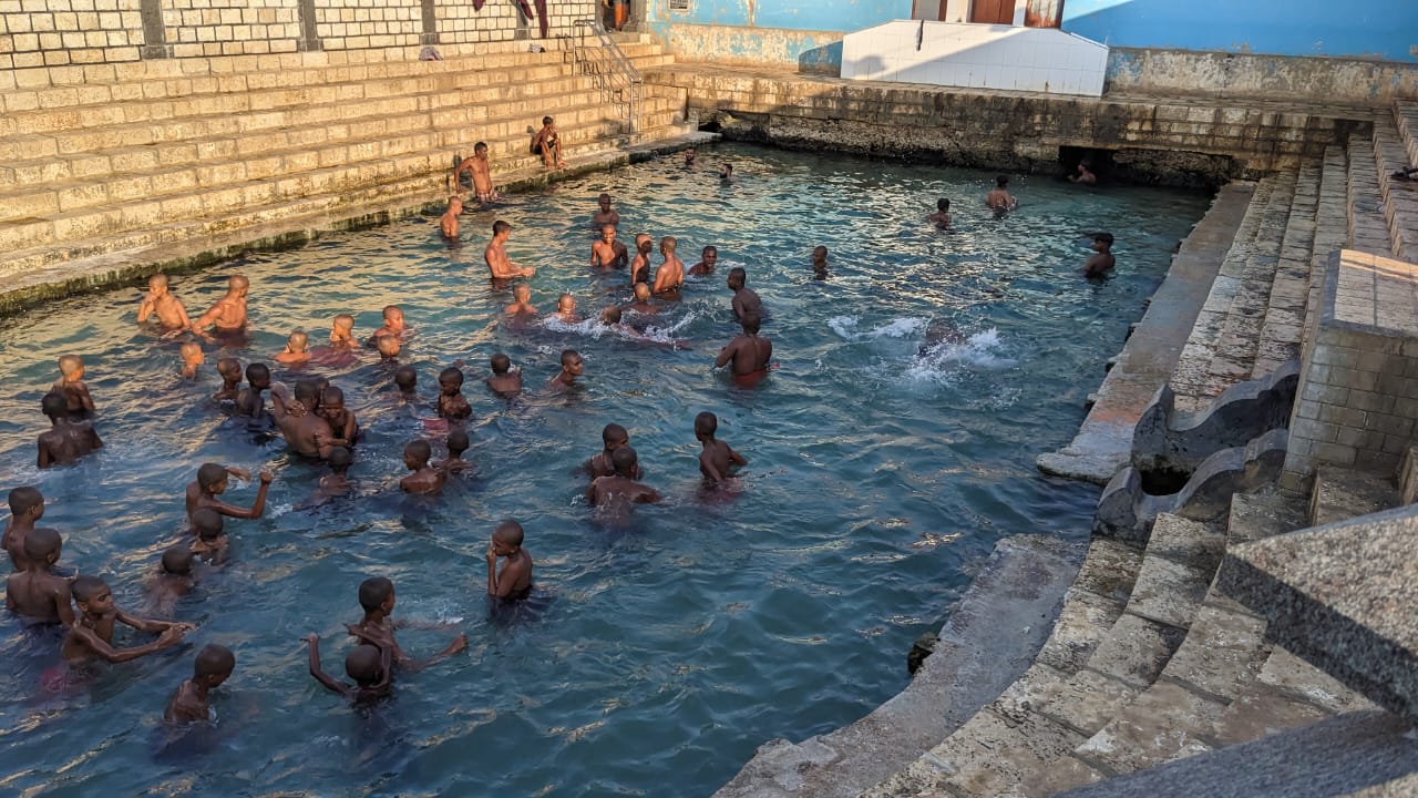 People bathing in the Keerimalai springs in Jaffna, Sri Lanka.