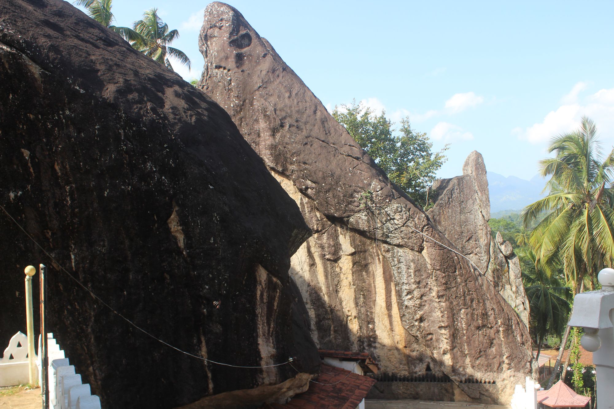 The towering rock walls of the Matale Aluviharaya rock cave temple in Sri Lanka