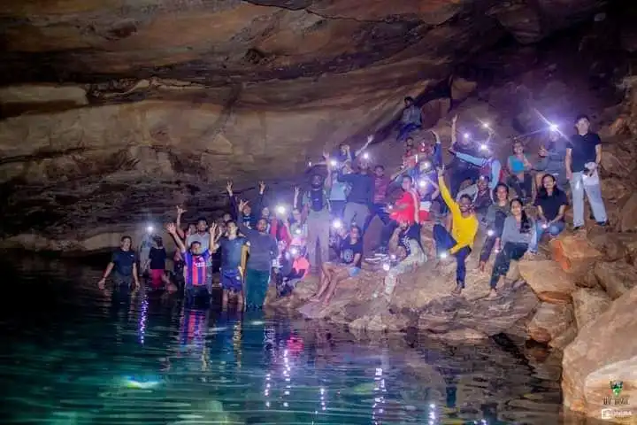 A group of travelers at Nil Diya Pokuna in Karandagolla, Ella, Sri Lanka